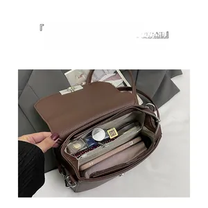 Interior view of large capacity brown leather bag showing organized storage space