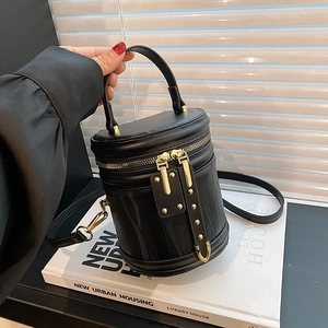 Retro black cylindrical crossbody bucket bag in premium leather with woven texture