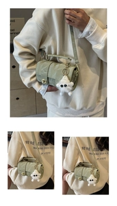 Sage green vintage satchel with marble texture, metal twist lock, and furry charm