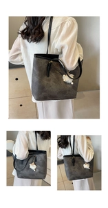 Detailed views of grey marble pattern tote bag with pompom and fashion text