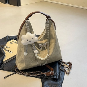 Retro khaki crescent shoulder bag with plush cloud charm and metal bow detail