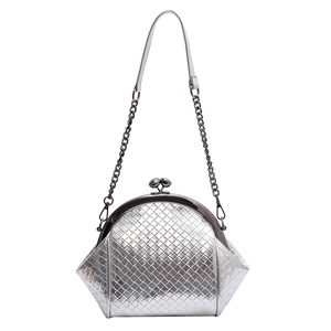 Silver woven metallic shell bag with round clasp and chain strap on white background