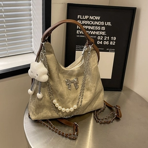 Chic khaki canvas handbag with pearl chain, leather strap, and cute plush cloud charm