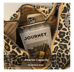 Interior detail of leopard print tote bag showing large capacity and internal pockets