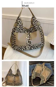 Detail view of khaki leopard print tote bag with metallic studs and double handles