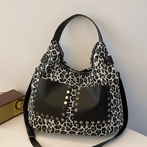Large leopard print hobo tote bag with studded leather pockets and dual shoulder straps