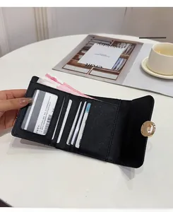 Internal layout of a large capacity black cross-grain leather trifold wallet for women
