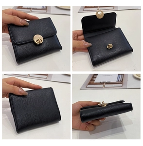 Detailed views of black pebbled leather wallet featuring a gold circular clasp and compact design