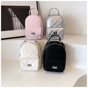 Quilted mini backpacks in four colors showing metallic hardware and chain straps