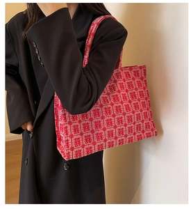 Detail of red bridal tote bag with traditional Double Happiness jacquard patterns
