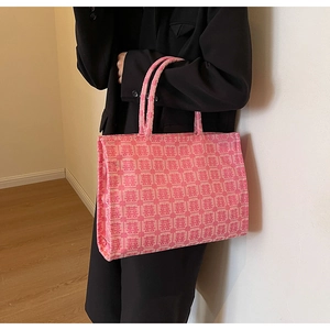 Close-up of pink jacquard tote bag with traditional double happiness pattern on fabric