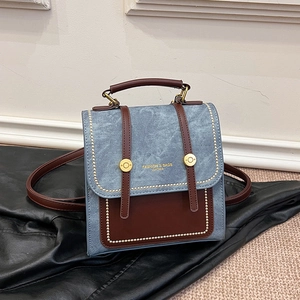 Blue denim and brown leather dual-use handbag and backpack with gold metal buckle