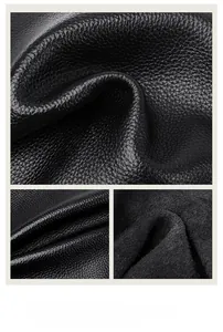 Detailed macro view of black litchi texture leather with premium grain and soft touch