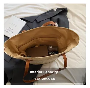 Detailed interior of woven straw tote showing zip pocket and spacious storage capacity