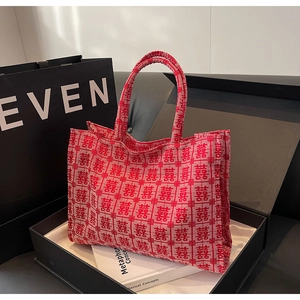 Detail of red festive canvas tote bag with double happiness jacquard pattern in gift box
