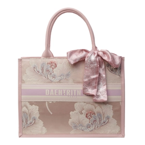 Pink embroidered canvas tote bag with floral patterns and decorative handle scarf