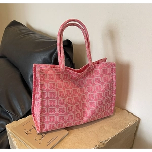 Detailed texture of pink jacquard tote bag featuring traditional double happiness patterns