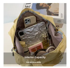 Spacious canvas shoulder bag interior showing large capacity for tablet and essentials