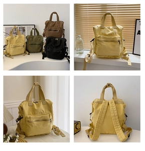 Detail view of large canvas backpack in four colors with front zipper pocket and dual handles