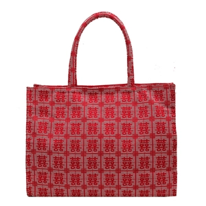 Red canvas tote bag with traditional Xi pattern and sturdy handles for wedding