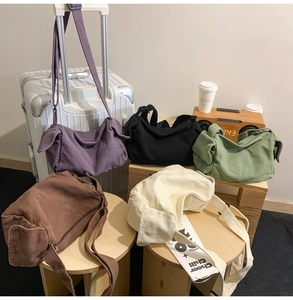 Collection of five colorful canvas crossbody bags with adjustable shoulder straps
