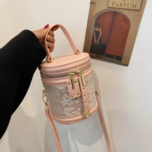 Pink bucket bag with rose jacquard embroidery and metal rivets for women