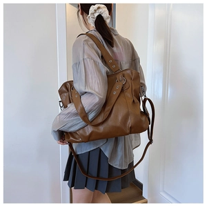Brown large capacity PU leather tote bag shown on model for daily commuting style