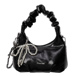 Glossy black cloud handbag with pearl bow pendant and silver chain strap