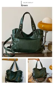Detail view of large green PU tote bag with metal rivets and detachable shoulder strap