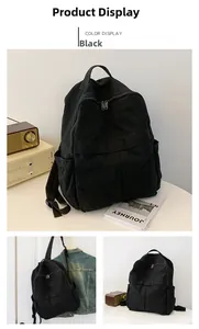 Vue détaillée du grand sac à dos en toile noire avec double fermeture éclair