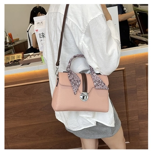 Pink lychee texture leather handbag with silk scarf handle and silver metal twist lock