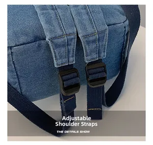 Close-up of durable denim backpack straps with adjustable black plastic buckles
