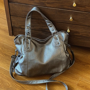 Metallic silver large tote bag with rivets and adjustable shoulder strap for women