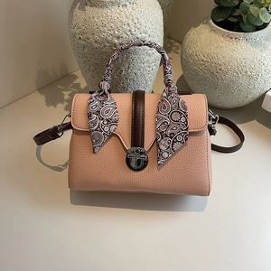 Pink lychee leather tote bag with silk scarf handle and adjustable crossbody strap