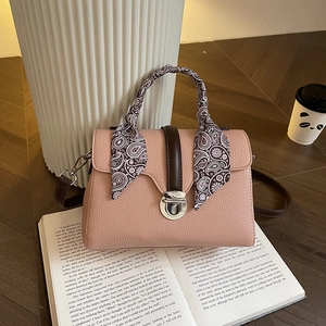 Pink lychee grain leather tote bag with paisley silk scarf handle and silver turn-lock