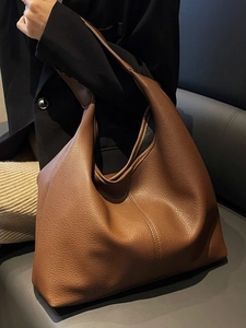 Large caramel brown hobo tote bag in lychee pattern leather with minimalist stitching