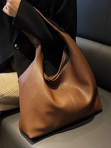 Large brown lychee leather tote bag with modern hobo style for commuting and daily use