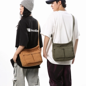 Unisex large canvas messenger bag in khaki and army green with dual front flap pockets