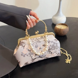 Elegant lavender floral cheongsam handbag with pearl handle and metal clasp closure