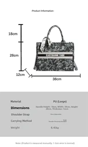 Close-up of black printed tote bag showing dimensions 38x28x12cm and silk scarf detail