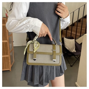 Canvas and olive green leather crossbody bag with decorative silk scarf and silver hardware