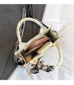Internal view of a canvas tote bag showing storage capacity for phone and wallet