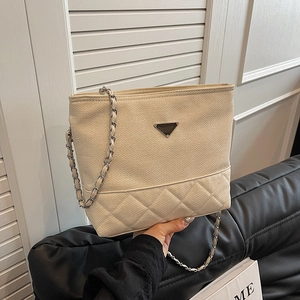Chic beige nylon crossbody bag with quilted diamond pattern and chain strap