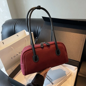 Retro burgundy frosted leather handbag with black contrast trim and white decorative stitching