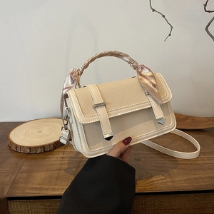 Chic beige woven crossbody bag with silk scarf handle and silver hardware accent