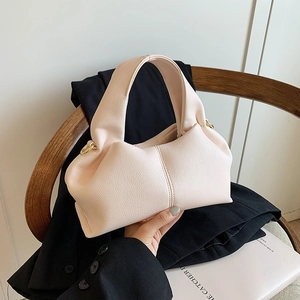 Chic apricot handbag with litchi grain leather and unique fold design for women