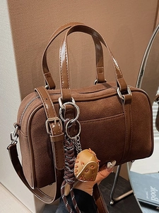 Retro dark brown frosted Boston bag with leather handles and baseball glove charm