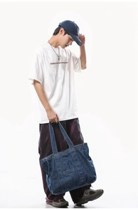 Deep blue denim tote bag for women showing large capacity and vintage washed texture