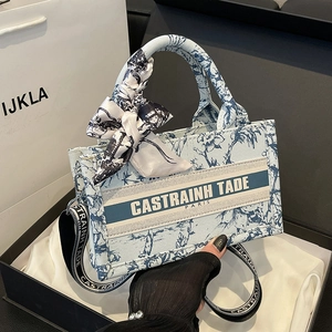 Blue floral canvas tote bag with retro letter print, scarf handle, and wide strap