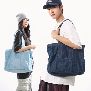 Chic denim tote bag for women featuring large capacity and dual-tone blue colors for daily use